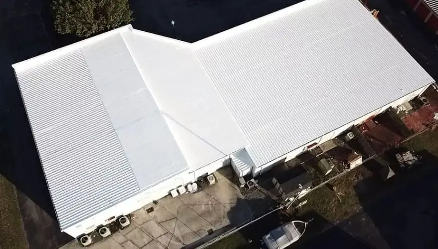 Commercial metal roof on a Rochester, NY facility maintained and restored by Empire State Commercial Roofing.
