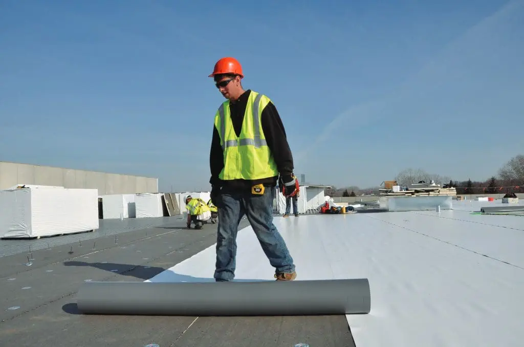 Single-ply commercial roofing membrane installed on a flat roof in Rochester, NY by Empire State Commercial Roofing.